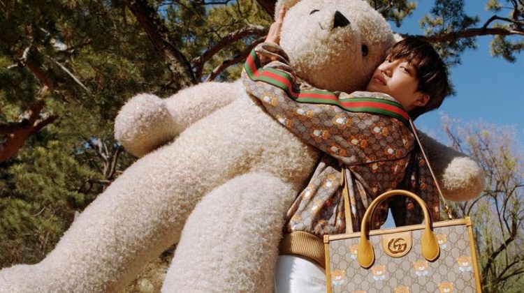 Kai poses with an oversized teddy bear in the campaign for his new Gucci capsule collection.