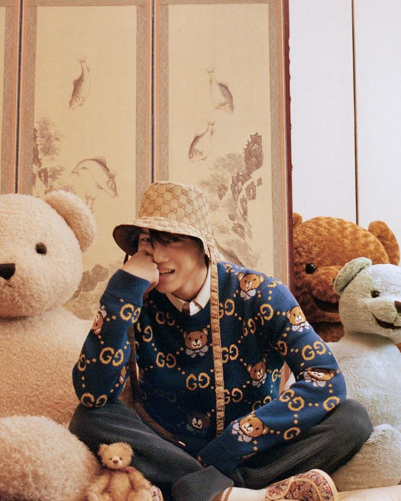 All smiles, Kai wears a teddy bear patterned sweater from his Gucci capsule collection.