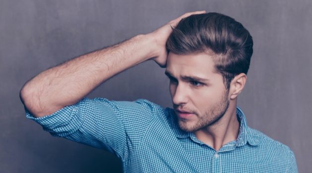 7 Laser Caps to Help Promote Hair Growth Male Model Touching Hair Blue Button-up Shirt
