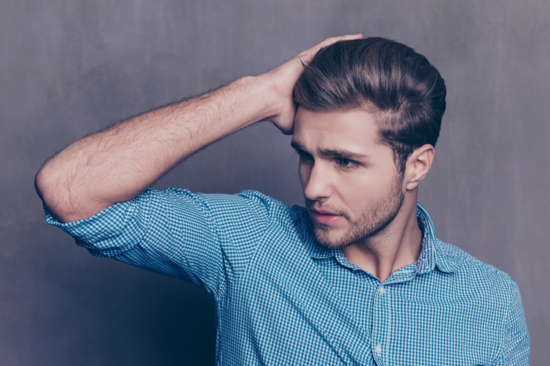 Male Model Tocuhing Hair Blue Buttonup Shirt Male Model Touching Hair Blue Button-up Shirt