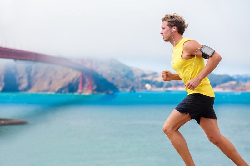 Man Running Yellow Tank Arm Band Black Shorts Activewear