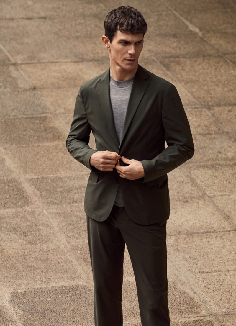 French model Vincent Lacrocq suits up in a packable collection slim-fit blazer and pants from Mango's High-Performance collection.