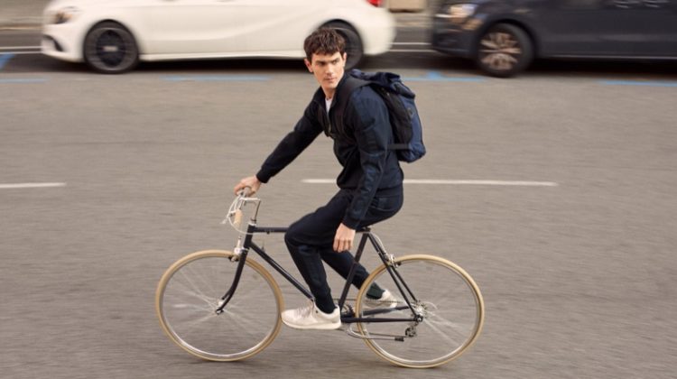 Going for a bike ride, Vincent Lacrocq models pieces from Mango's High-Performance collection.