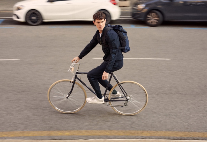 Going for a bike ride, Vincent Lacrocq models pieces from Mango's High-Performance collection.