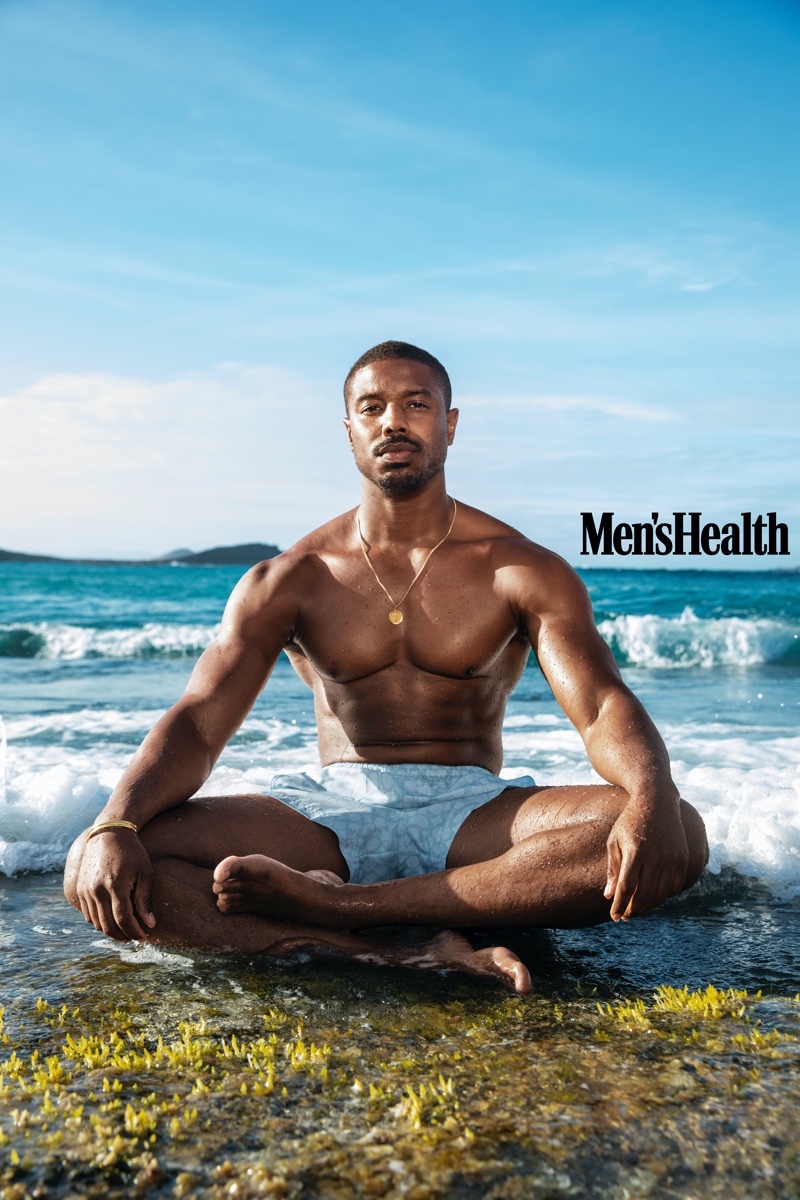 Taking to St. Barts with Men's Health, Michael B. Jordan sports Coach swim shorts with a Movado bracelet.