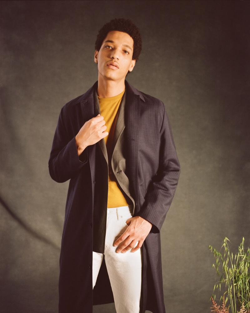 Making a smart statement, Peter Finn models Mr P.'s pinstriped virgin wool, merino wool, and silk-blend car coat.