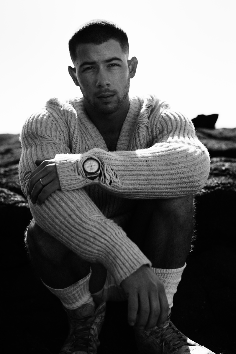 Appearing in a promotional image for "Spaceman," Nick Jonas wears the Speedmaster Moonwatch Master Chronometer Canopus Gold watch.