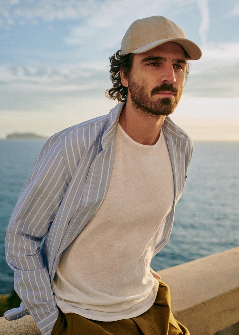 Nono Marquis dons a striped Charlie shirt with a cap and more from Octobre's spring 2021 collection. » Octobre Delivers a Sun-drenched Spring Collection Nono Marquis dons a striped Charlie shirt with a cap and more from Octobre's spring 2021 collection.