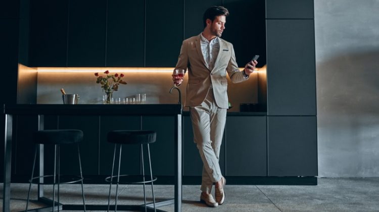 Stylish Man Home Kitchen Suit Holding Glass