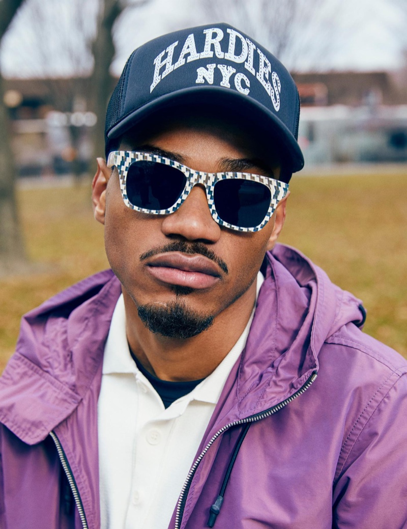 Tyshawn Jones sports his Harris checkered bone and whirlpool sunglasses, made in collaboration with Warby Parker.