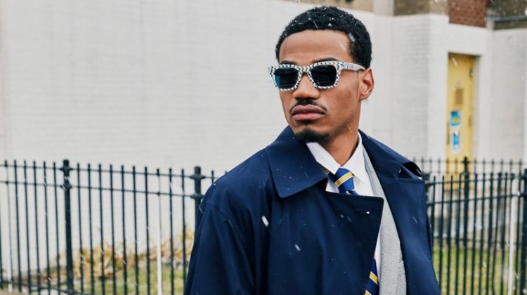Sporting a dapper look, Tyshawn Jones wears his Harris checkered bone and whirlpool sunglasses, made in collaboration with Warby Parker.
