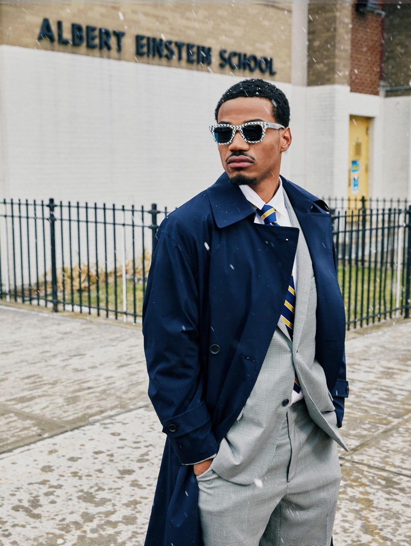 Sporting a dapper look, Tyshawn Jones wears his Harris checkered bone and whirlpool sunglasses, made in collaboration with Warby Parker.