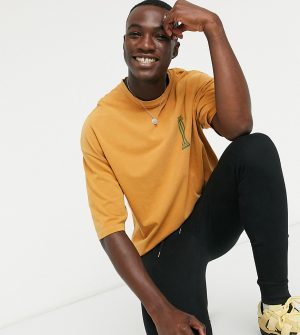 ASOS DESIGN Tall oversized heavyweight t-shirt with small chest historic print in yellow acid wash ASOS DESIGN Tall oversized heavyweight t-shirt with small chest historic print in yellow acid wash