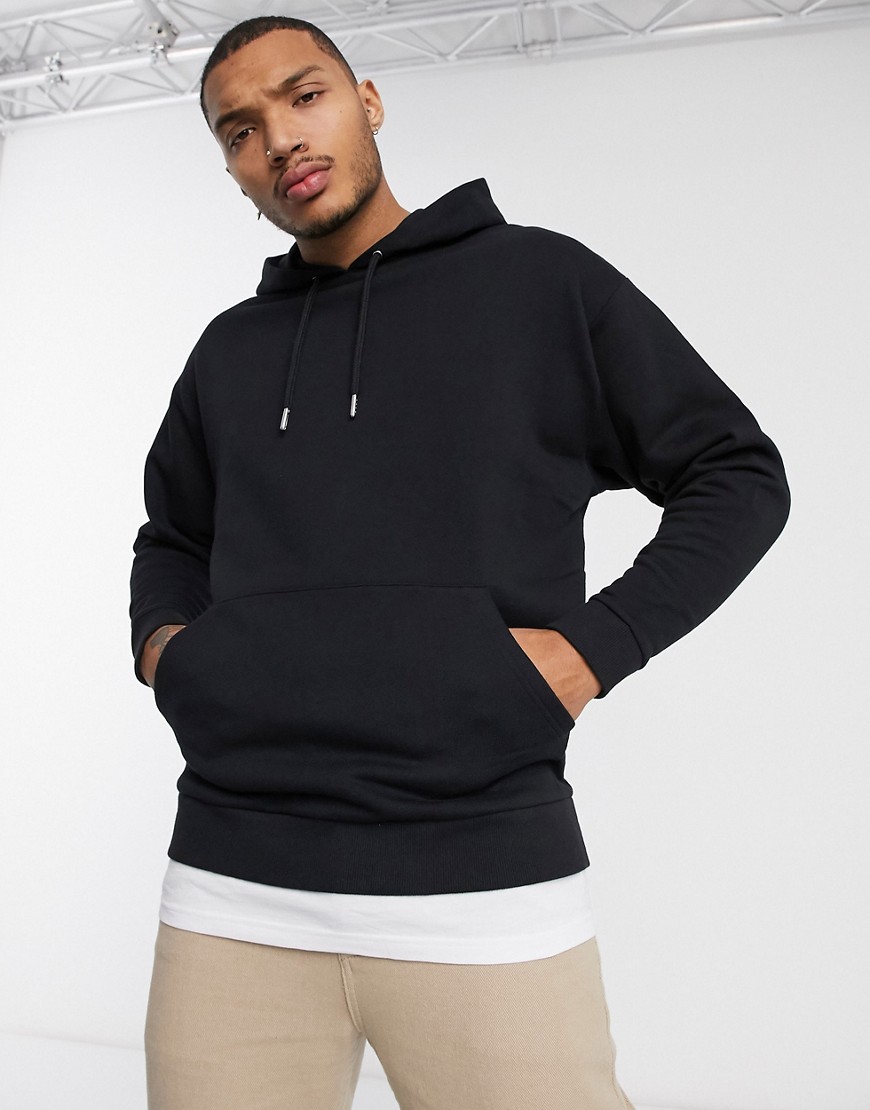 ASOS DESIGN oversized hoodie in black with t-shirt hem | The Fashionisto