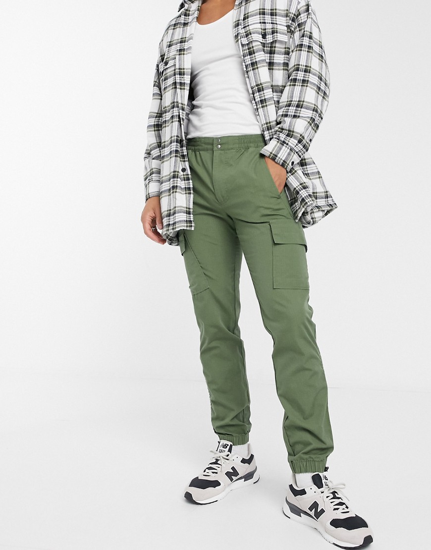 ASOS DESIGN slim cargo pants with toggle hem in khaki ripstop-Green ...