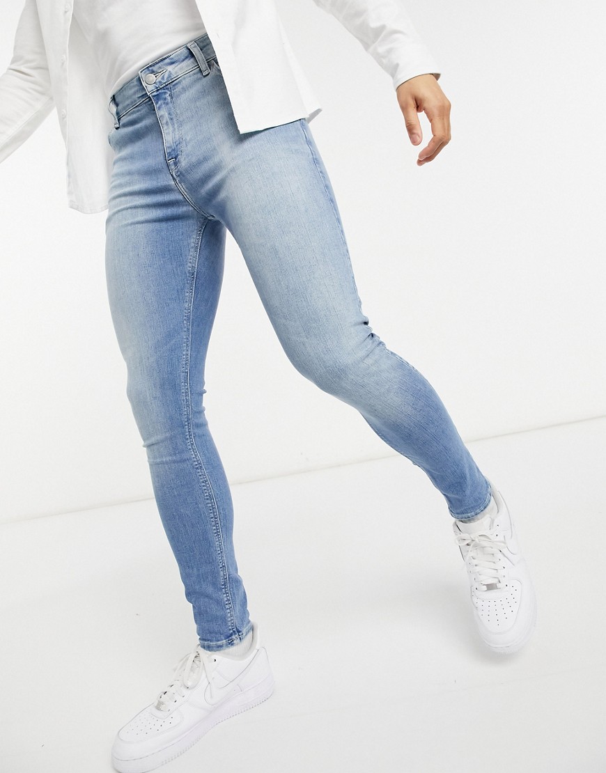 ASOS DESIGN spray on jeans in power stretch denim in light washBlue