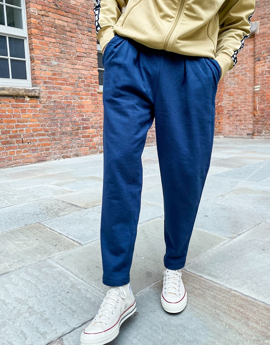 ASOS DESIGN tapered sweatpants with pleats in navy The Fashionisto