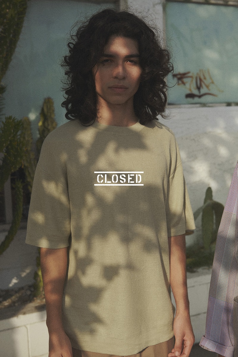 Ernesto Cervantes wears an oversized shirt from Closed's summer 2021 collection.