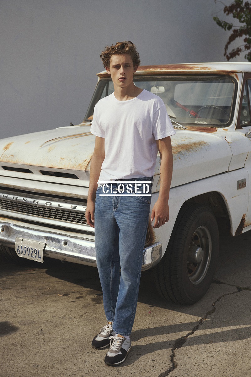 Front and center, Elijah Claxton goes casual in a t-shirt and jeans from Closed.