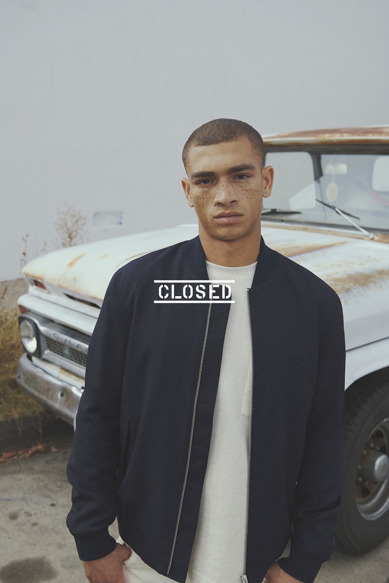 Tristan Stovall rocks a bomber jacket and top from Closed.