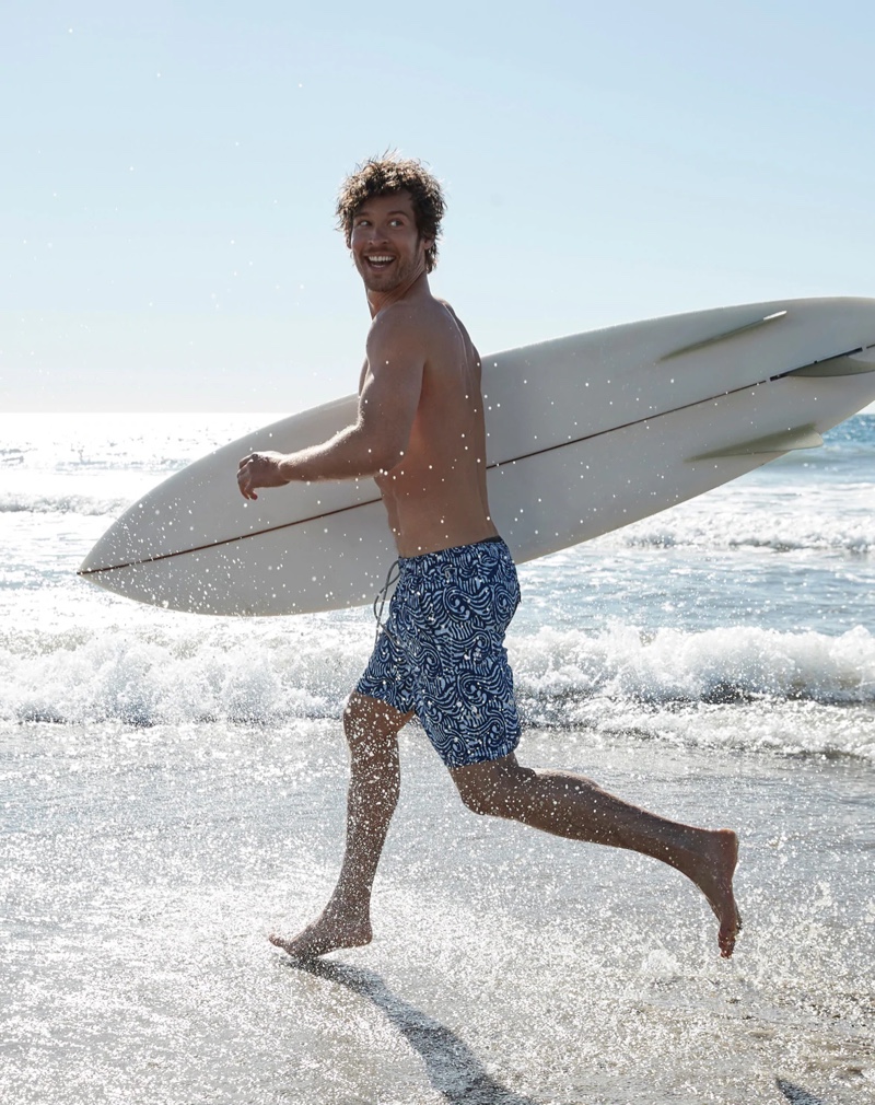 Josh Upshaw models a pair of J.Crew's 8" stretch swim trunks in batik print.