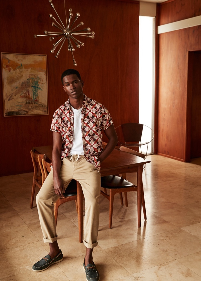 Front and center, Salomon Diaz dons a printed short-sleeve shirt with drawstring pants from J.Crew.