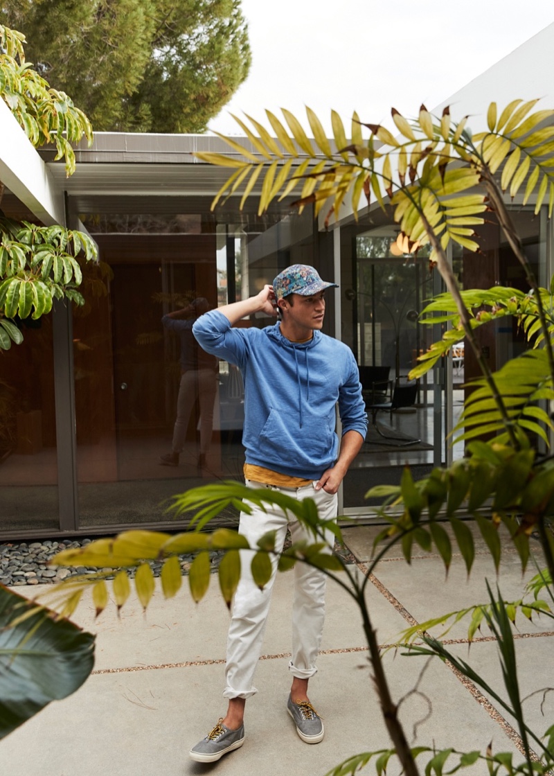 Going casual, Miles McMillan sports a lightweight hoodie and pants from J.Crew.