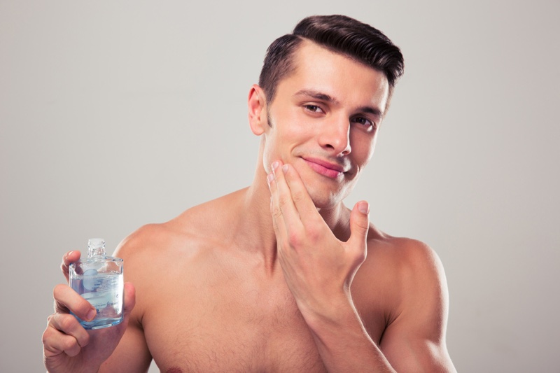 Male Touching Face Aftershave Grooming