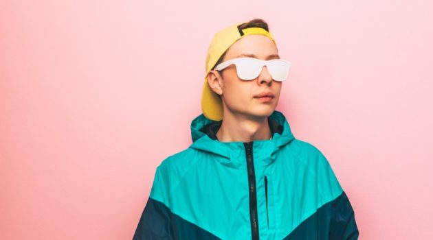 Put Together a Killer Outfit for Your Next Rave Man Neon Jacket White Glasses Retro Rave