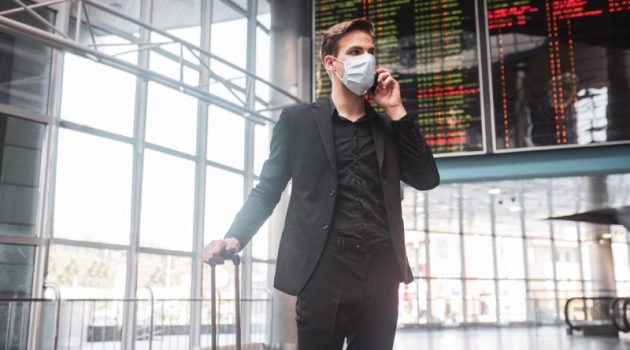 How to Prepare for Your Trip to Washington D.C. in 2021 Man Traveling Airport Face Mask