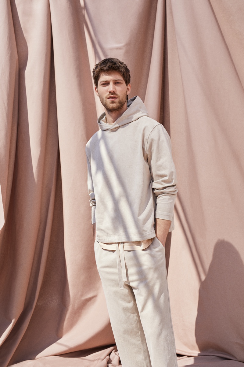 Front and center, Boyd Gates wears a t-shirt, hoodie, and more from Mango Committed's Mineral Dyes capsule collection.