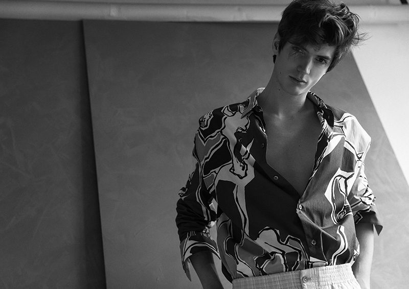 Embracing a graphic print, Ollie Greb dons a Hermès shirt.