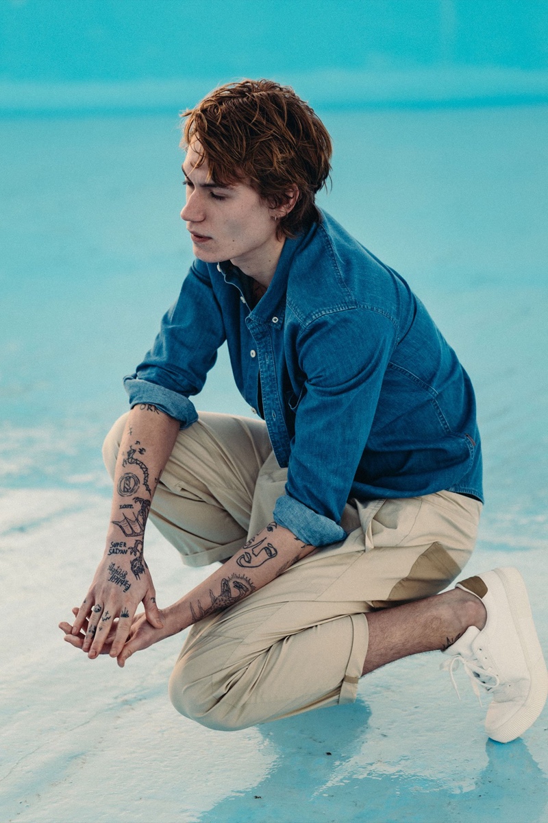 Bart Pogoda photographs Anton Thiemke in a denim shirt and khaki pants by Reserved.