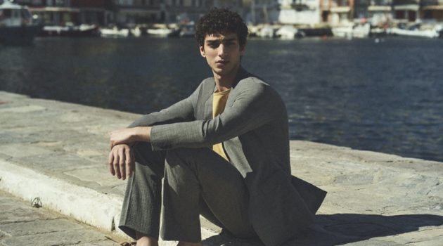 Qaher Harhash Sports Neutrals for Theory Spring Campaign Donning a trim suit, Qaher Harhash stars in Theory's spring-summer 2021 campaign.