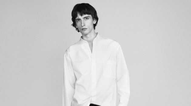 Benno & Benoit Sport Oversized Styles for UNIQLO +J Spring Campaign Benno Bulang dons a crisp white band-collar shirt with black trousers for UNIQLO +J's spring 2021 campaign.