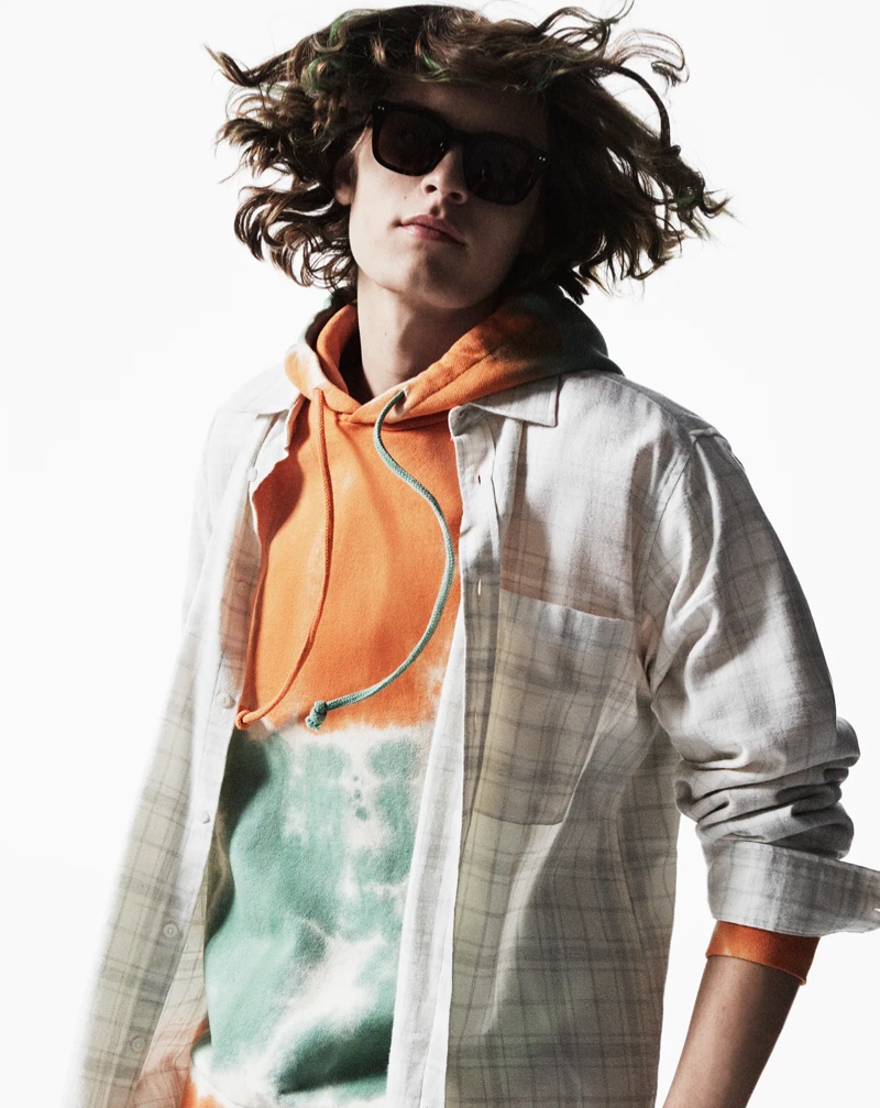 Zachary Norton rocks a tie-dye hoodie and check shirt from Zara.