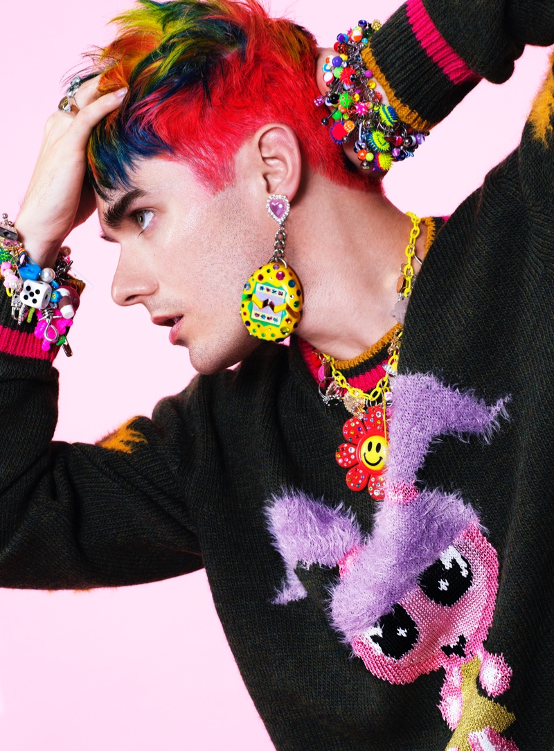 Delivering a side profile, Awsten Knight dons a Marc Jacobs top with his own rings and Laser Kitten accessories for VMAN. 