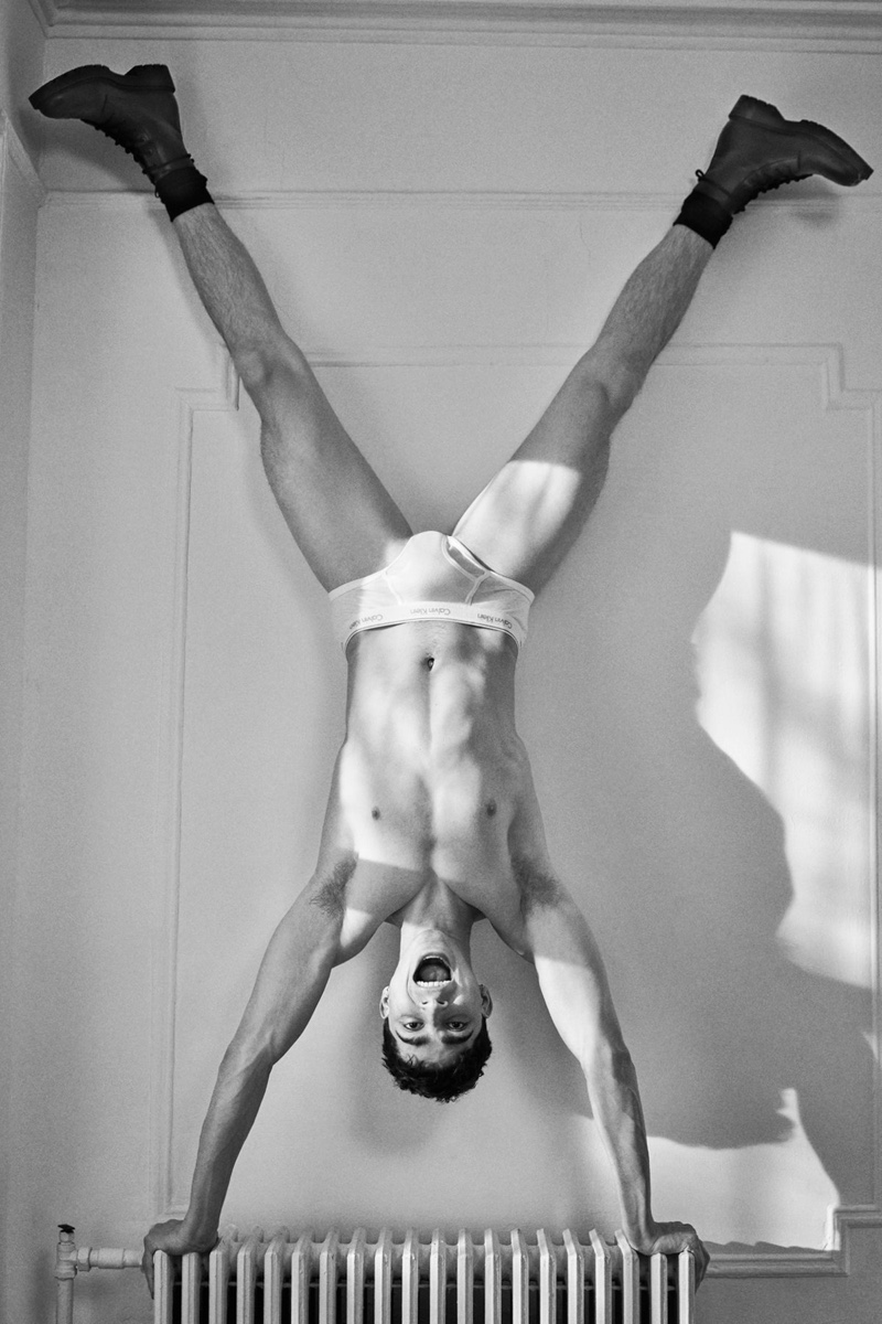 Doing a handstand, Isaac Cole Powell fronts Calvin Klein's #proudinmycalvins campaign.