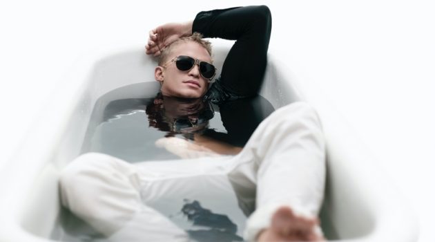 Soaking in a tub, Cody Simpson fronts Versace's spring-summer 2021 eyewear campaign.