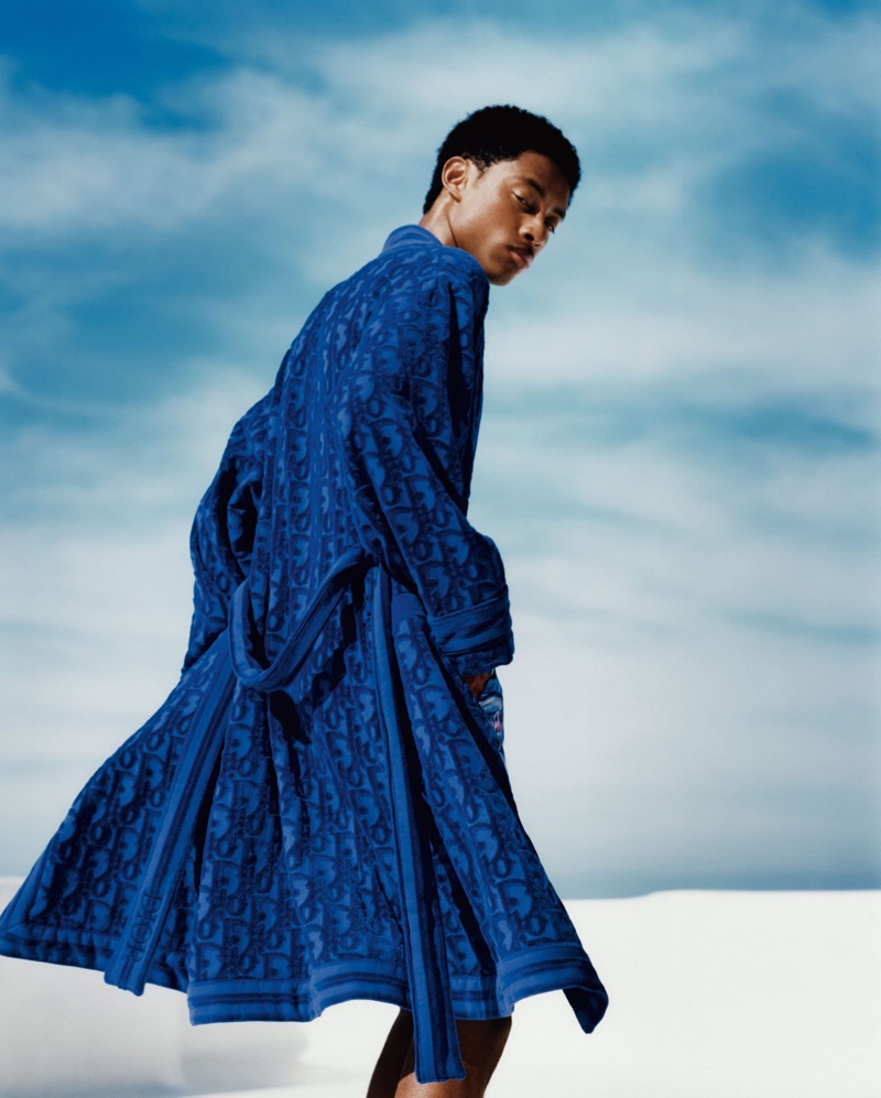 Eddie Wrey photographs Jecardi Sykes in a luxurious blue robe from Dior Men's 2021 beachwear capsule collection.