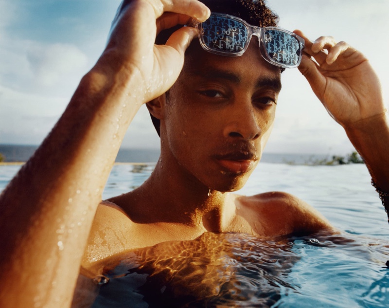 Connecting with Dior Men, Jecardi Sykes wears the brand's new clear-framed logo sunglasses. » Dior Men is Ready to Hit the Beach with New Collection Connecting with Dior Men, Jecardi Sykes wears the brand's new clear-framed logo sunglasses.
