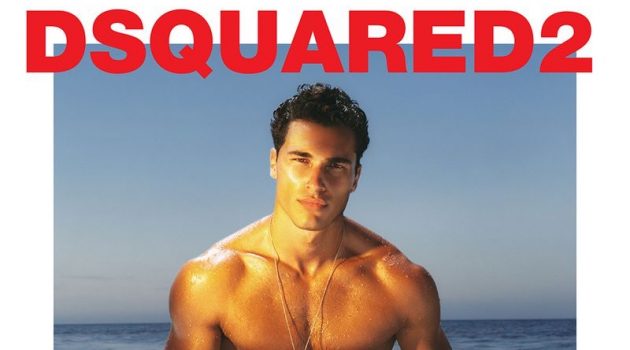 Sporting a logo print swimsuit, Dean Perona fronts Dsquared2's 2021 beachwear campaign.