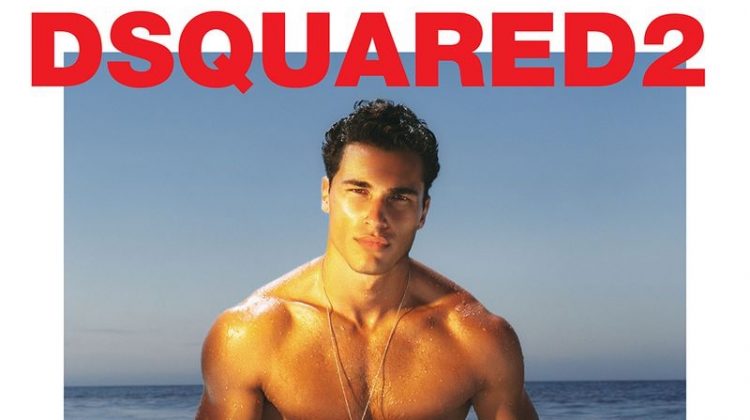 Sporting a logo print swimsuit, Dean Perona fronts Dsquared2's 2021 beachwear campaign.