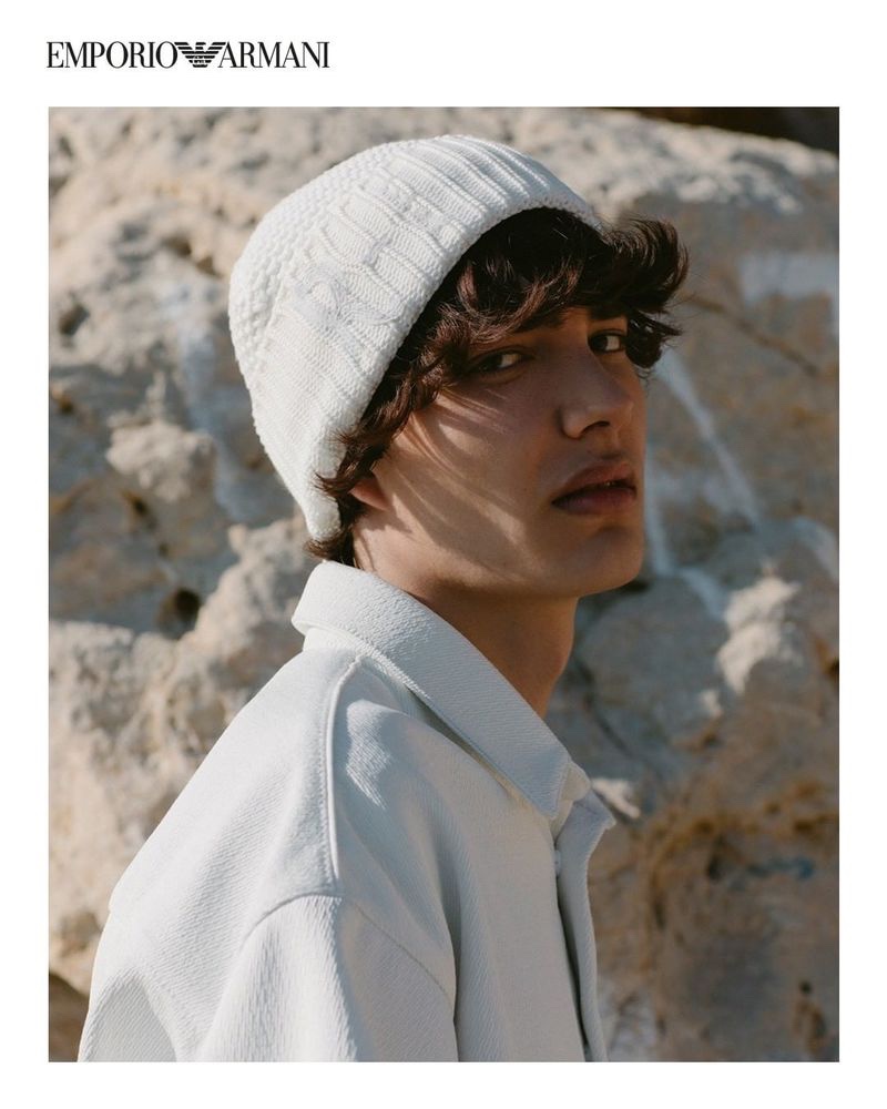 Front and center, Hernan Cano dons a knit beanie and jacket from Emporio Armani's spring-summer 2021 sustainable capsule collection.