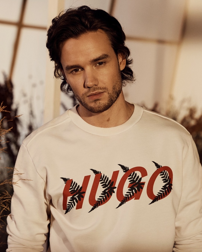 Front and center, Liam Payne wears a forest-inspired HUGO sweatshirt from his spring-summer 2021 capsule for the label.