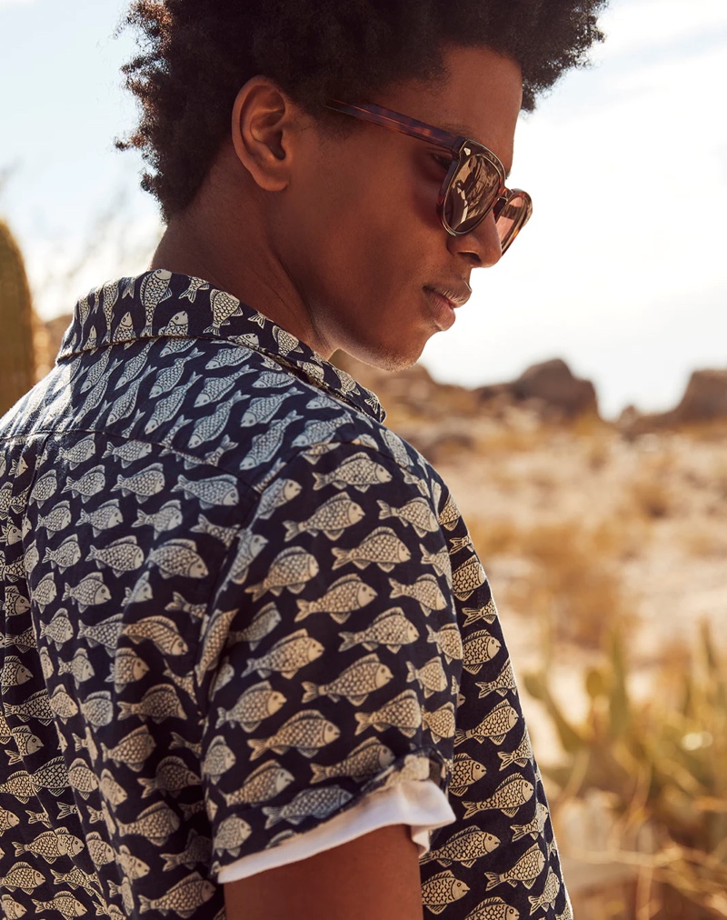 Rafael Mieses dons a J.Crew fish print linen short-sleeve shirt with Dock sunglasses.