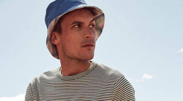 Miles Garber & Rafael Mieses Model J.Crew Summer Essentials Miles Garber sports a J.Crew striped sweater with dock shorts and a reversible plaid bucket hat.