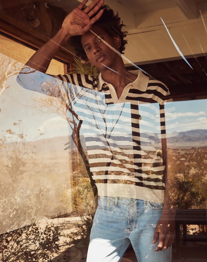 Front and center, Rafael Mieses sports a J.Crew short-sleeve striped Johnny collared polo with 1040 athletic-fit stretch jeans.