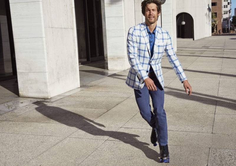 Rollerblading, Josh Upshaw inspires in a tailored ensemble from Kiton for Neiman Marcus.