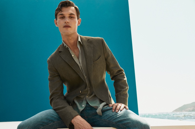Embracing sleek style, Kit Butler wears a slim fit 100% linen blazer with stonewashed casual fit jeans and khaki split suede leather espadrilles from Massimo Dutti.